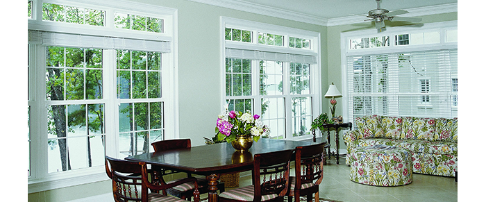 Dining room with large windows and patio doors transom windows